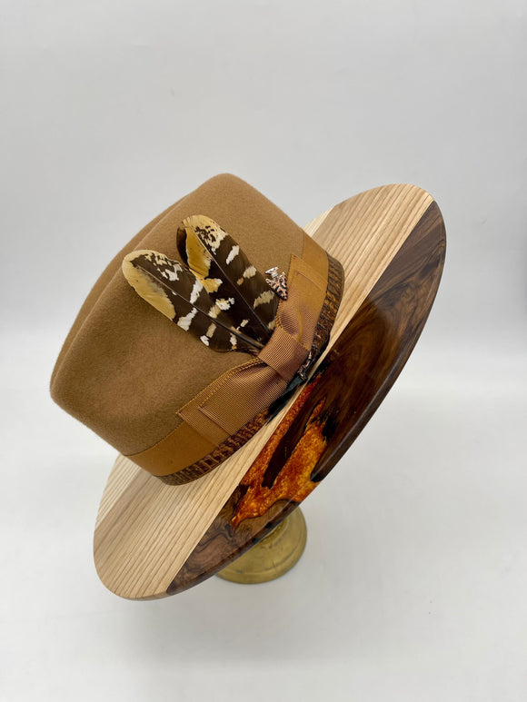 walnut wood brim with maple and caramel colored epoxy, caramel wool crown, matching bow and hat band with feathers